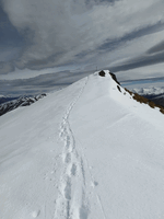 Footprints on a snowcovered cantered peak