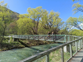 Walking across the Arrow River on a bridge with Aunty Jo and Soph