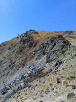 Stone outcrops and tussock grass