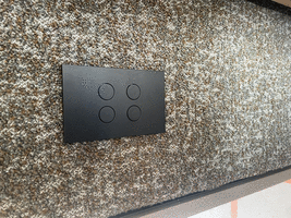 Switches mounted to a carpeted wall