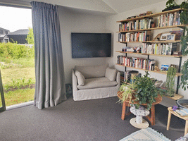 TV mounted to wall in corner nook